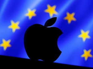 A 3D printed Apple logo is seen in front of a displayed European Union flag in this illustration